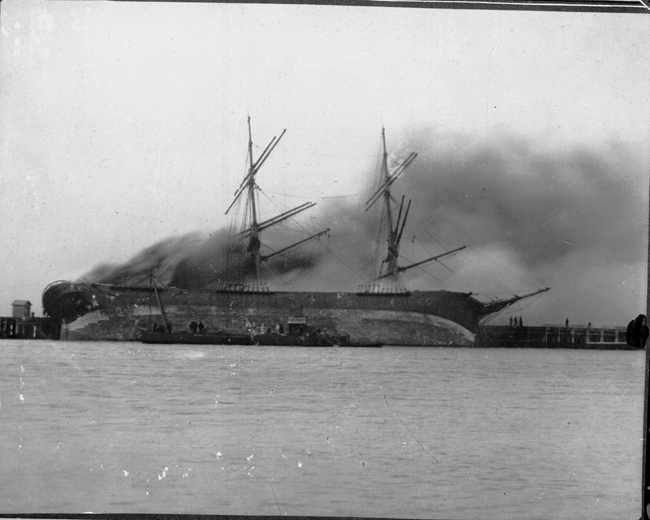 Hilaria on fire at Town Pier Port Melbourne. 1895 (Brodie Collection, La Trobe Picture Collection, State Library of Victoria)