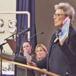 Janet Bolitho shows her well used volume of The Borough and Its People by Margaret and Graham Bride during her tribute to Graham.